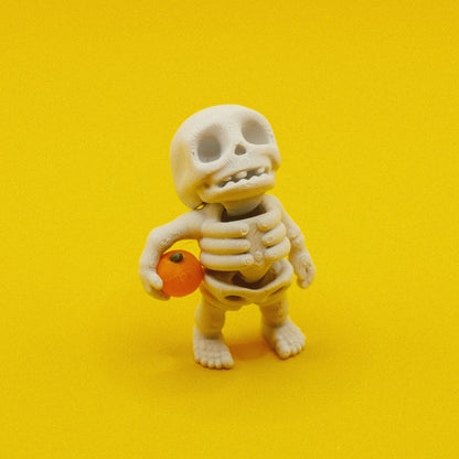 Skeleton Holding Pumpkin